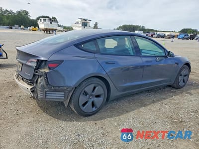 Trzecie zdjęcie samochodu z tyłu: 2021 TESLA MODEL 3 VIN:5YJ3E1EB8MF923705 - miniatura