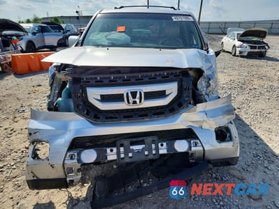 Piąte zdjęcie samochodu w środku: 2011 HONDA PILOT TOURING VIN:5FNYF4H9XBB032454 - miniatura