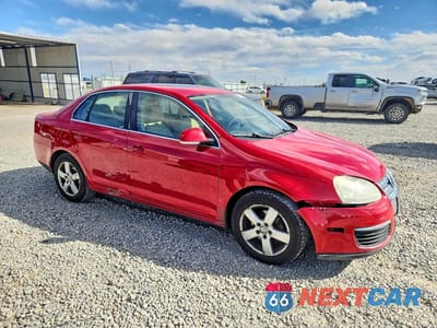 Czwarte zdjęcie samochodu z boku: 2009 VOLKSWAGEN JETTA SE VIN:3VWRM71K39M047826 - miniatura