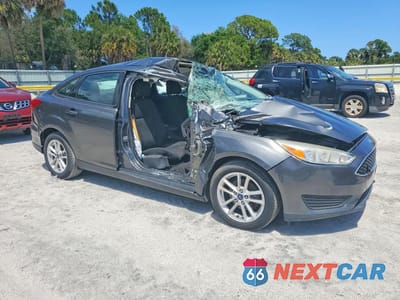 Czwarte zdjęcie samochodu z boku: 2017 FORD FOCUS SE VIN:1FADP3F23HL235029 - miniatura