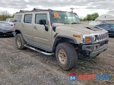 Czwarte zdjęcie samochodu z boku: 2004 HUMMER H2 VIN:5GRGN23U64H118618 - miniatura