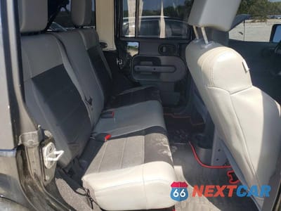 Zdjęcie 11 z 12 samochodu: 2010 JEEP WRANGLER UNLIMITED SAHARA VIN:1J4HA5H15AL213434 - miniatura