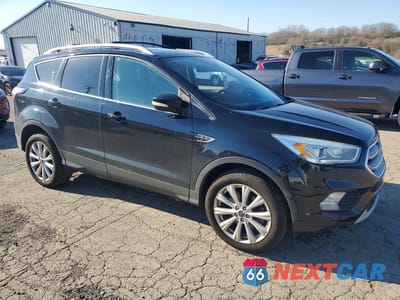 Czwarte zdjęcie samochodu z boku: 2017 FORD ESCAPE TITANIUM VIN:1FMCU9JD6HUD56539 - miniatura