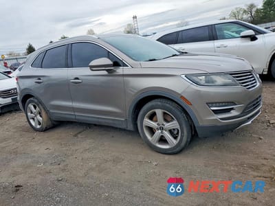 Czwarte zdjęcie samochodu z boku: 2016 LINCOLN MKC PREMIERE VIN:5LMCJ1D91GUJ11631 - miniatura