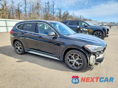 Czwarte zdjęcie samochodu z boku: 2019 BMW X1 XDRIVE28I VIN:WBXHT3C5XK5L91007 - miniatura