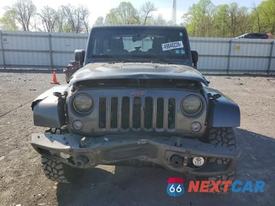 Piąte zdjęcie samochodu w środku: 2016 JEEP WRANGLER SAHARA VIN:1C4GJWBG8GL322323 - miniatura