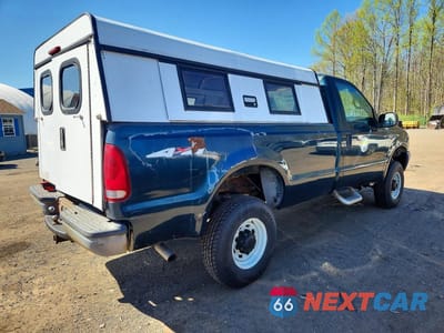 Trzecie zdjęcie samochodu z tyłu: 1999 FORD F250 SUPER DUTY VIN:1FTNF21L8XED31799 - miniatura