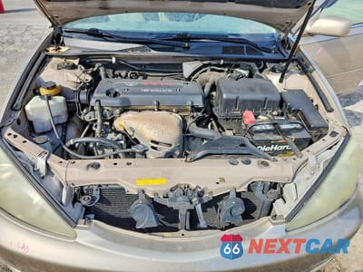 Zdjęcie 11 z 11 samochodu: 2003 TOYOTA CAMRY LE VIN:4T1BE32K33U674212 - miniatura