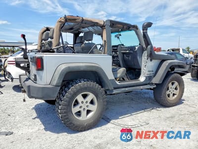 Trzecie zdjęcie samochodu z tyłu: 2010 JEEP WRANGLER SPORT VIN:1J4AA2D19AL119997 - miniatura