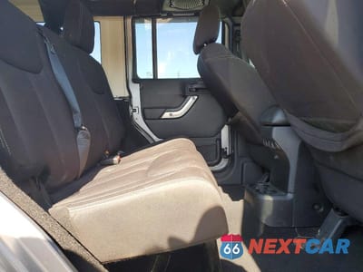 Zdjęcie 10 z 12 samochodu: 2013 JEEP WRANGLER UNLIMITED SAHARA VIN:1C4BJWEG7DL662953 - miniatura