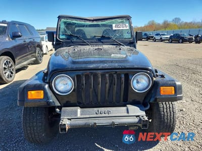 Piąte zdjęcie samochodu w środku: 2000 JEEP WRANGLER / TJ SPORT VIN:1J4FA49S7YP778103 - miniatura
