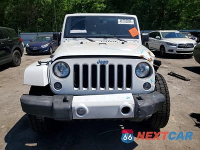 Piąte zdjęcie samochodu w środku: 2016 JEEP WRANGLER UNLIMITED SAHARA VIN:1C4BJWEG7GL144264 - miniatura