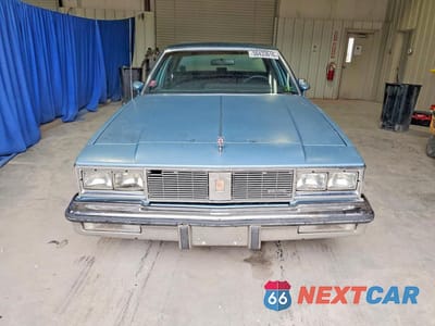 Piąte zdjęcie samochodu w środku: 1987 OLDSMOBILE CUTLASS SUPREME BROUGHAM VIN:2G3GM51Y4H2335843 - miniatura
