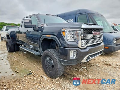 Czwarte zdjęcie samochodu z boku: 2020 GMC SIERRA K3500 DENALI VIN:1GT49WEY3LF221537 - miniatura