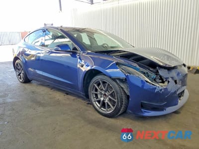 Czwarte zdjęcie samochodu z boku: 2023 TESLA MODEL 3 VIN:5YJ3E1EA0PF448580 - miniatura