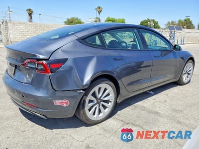 Trzecie zdjęcie samochodu z tyłu: 2023 TESLA MODEL 3 VIN:5YJ3E1EA7PF683736 - miniatura