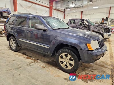 Czwarte zdjęcie samochodu z boku: 2010 JEEP GRAND CHEROKEE LAREDO VIN:1J4PR4GK4AC139903 - miniatura