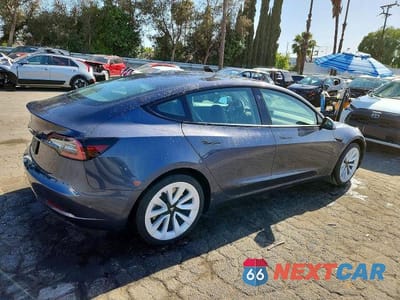 Trzecie zdjęcie samochodu z tyłu: 2023 TESLA MODEL 3 VIN:5YJ3E1EA3PF447794 - miniatura