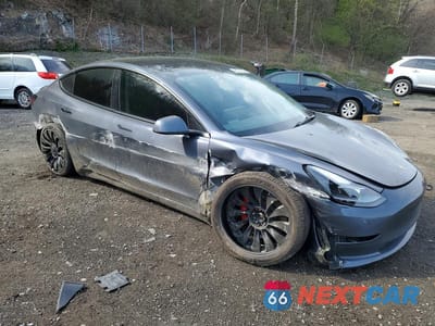 Czwarte zdjęcie samochodu z boku: 2022 TESLA MODEL 3 VIN:5YJ3E1EC6NF269524 - miniatura