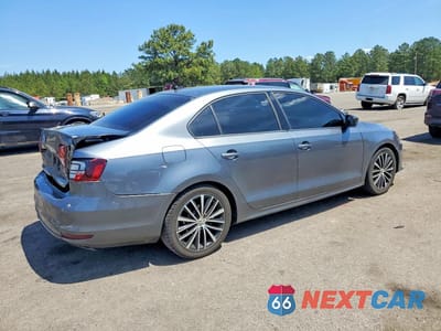 Trzecie zdjęcie samochodu z tyłu: 2016 VOLKSWAGEN JETTA SPORT VIN:3VWD17AJ7GM248684 - miniatura
