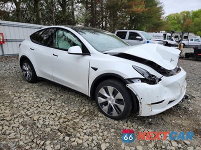 Czwarte zdjęcie samochodu z boku: 2022 TESLA MODEL Y VIN:7SAYGDEE5NF563339 - miniatura