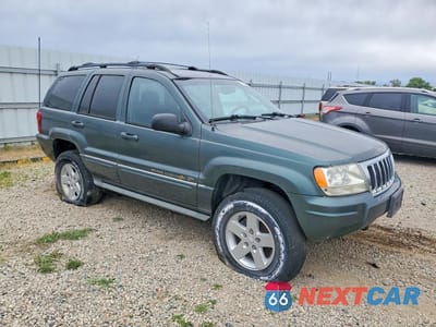 Czwarte zdjęcie samochodu z boku: 2004 JEEP GRAND CHEROKEE OVERLAND VIN:1J8GW68J84C216009 - miniatura