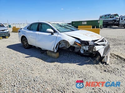 Czwarte zdjęcie samochodu z boku: 2024 TOYOTA CAMRY HYBRID SE VIN:4T1S31AK7RU061594 - miniatura