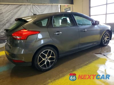Trzecie zdjęcie samochodu z tyłu: 2017 FORD FOCUS SEL VIN:1FADP3M27HL265248 - miniatura