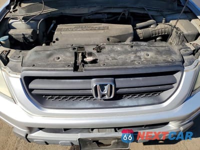 Zdjęcie 12 z 13 samochodu: 2004 HONDA PILOT EX VIN:2HKYF18464H514233 - miniatura