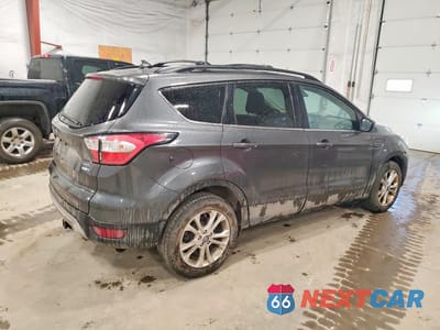 Trzecie zdjęcie samochodu z tyłu: 2018 FORD ESCAPE SEL VIN:1FMCU9HD2JUA07888 - miniatura