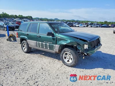 Czwarte zdjęcie samochodu z boku: 1998 JEEP GRAND CHEROKEE LAREDO VIN:1J4FX58S7WC317266 - miniatura