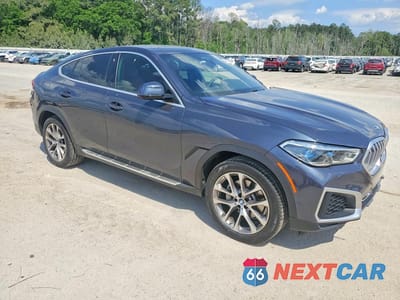 Czwarte zdjęcie samochodu z boku: 2022 BMW X6 XDRIVE40I VIN:5UXCY6C04N9K23017 - miniatura