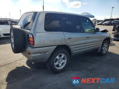 Trzecie zdjęcie samochodu z tyłu: 2000 TOYOTA RAV4 BASE VIN:JT3GP10V2Y7071199 - miniatura