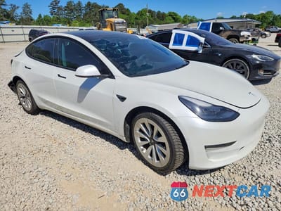 Czwarte zdjęcie samochodu z boku: 2022 TESLA MODEL 3 VIN:5YJ3E1EB7NF272293 - miniatura