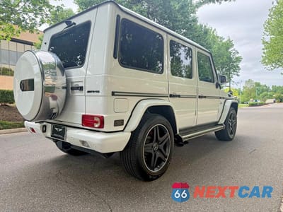 Czwarte zdjęcie samochodu z boku: 2014 MERCEDES-BENZ G 63 AMG VIN:WDCYC7DF5EX221359 - miniatura