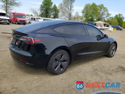 Trzecie zdjęcie samochodu z tyłu: 2023 TESLA MODEL 3 VIN:5YJ3E1EA0PF689748 - miniatura