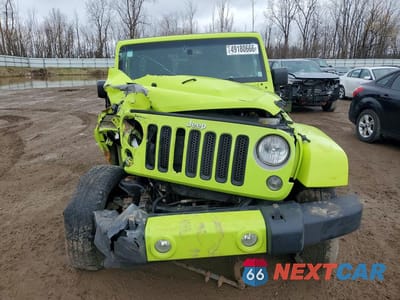 Piąte zdjęcie samochodu w środku: 2016 JEEP WRANGLER UNLIMITED SAHARA VIN:1C4BJWEG3GL292346 - miniatura