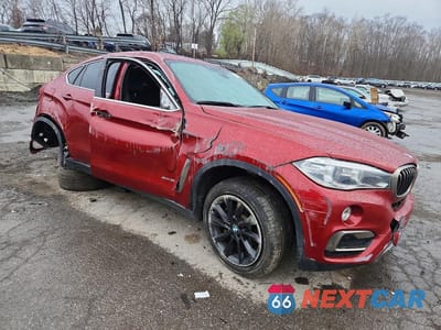 Czwarte zdjęcie samochodu z boku: 2019 BMW X6 XDRIVE35I VIN:5UXKU2C58K0Z62807 - miniatura