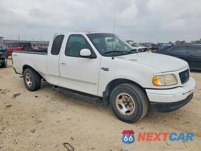 Czwarte zdjęcie samochodu z boku: 2001 FORD F150 VIN:1FTZX17201KB49871 - miniatura