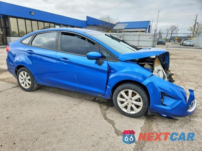 Czwarte zdjęcie samochodu z boku: 2011 FORD FIESTA SE VIN:3FADP4BJ6BM108686 - miniatura