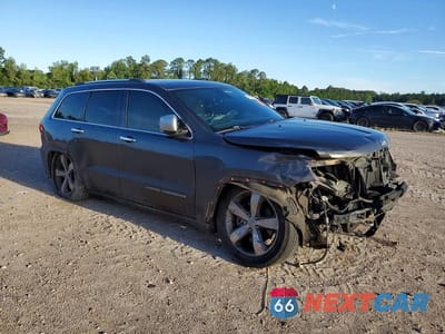 Czwarte zdjęcie samochodu z boku: 2014 JEEP GRAND CHEROKEE OVERLAND VIN:1C4RJFCM2EC329679 - miniatura