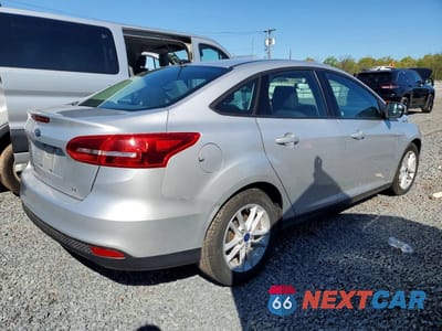 Trzecie zdjęcie samochodu z tyłu: 2018 FORD FOCUS SE VIN:1FADP3F29JL306661 - miniatura