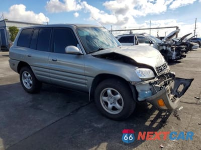 Czwarte zdjęcie samochodu z boku: 2000 TOYOTA RAV4 BASE VIN:JT3GP10V2Y7071199 - miniatura