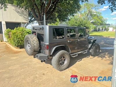 Czwarte zdjęcie samochodu z boku: 2014 JEEP WRANGLER UNLIMITED SPORT VIN:1C4BJWDG2EL244139 - miniatura