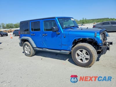 Czwarte zdjęcie samochodu z boku: 2016 JEEP WRANGLER UNLIMITED SPORT VIN:1C4BJWDG7GL247699 - miniatura