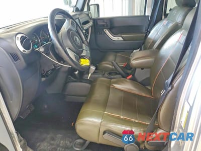 Zdjęcie 7 z 12 samochodu: 2011 JEEP WRANGER VIN:1J4HA7H1XBL612921 - miniatura