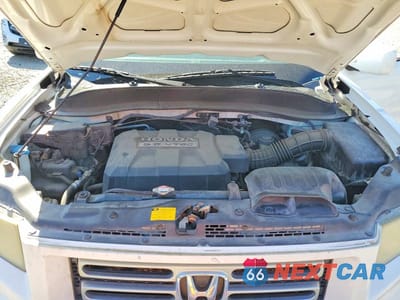 Zdjęcie 11 z 12 samochodu: 2006 HONDA RIDGELINE RTS VIN:2HJYK16426H557490 - miniatura