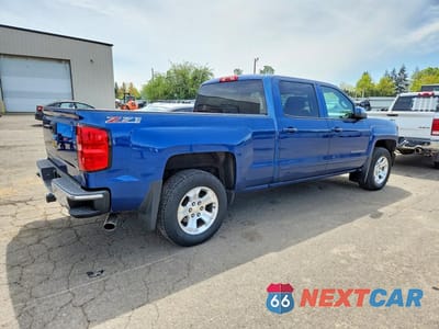 Trzecie zdjęcie samochodu z tyłu: 2015 CHEVROLET SILVERADO K1500 LT VIN:3GCUKREC0FG228409 - miniatura