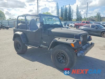 Czwarte zdjęcie samochodu z boku: 1997 JEEP WRANGLER / TJ SE VIN:1J4FY29P0VP438623 - miniatura