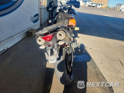 Czwarte zdjęcie samochodu z boku: 2010 KTM 990 SUPERMOTO VIN:VBKVS9406AM970054 - miniatura